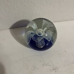 Vintage hand-blown art glass Blue paperweight with White Flower.