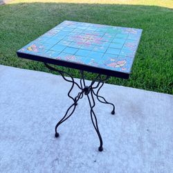 20th Century tile-top wrought iron garden table 24" H x 17.75" W x 17.5" D one sold at Auction $531 Adjustable feet  The small garden table with a squ