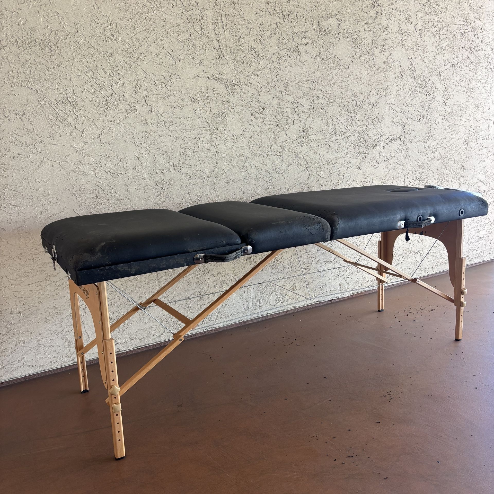 One Black Massage Table With accessories and Black Carrying Case
