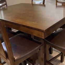 Solid wood tall bistro table with 4 chairs (Moving Sell)