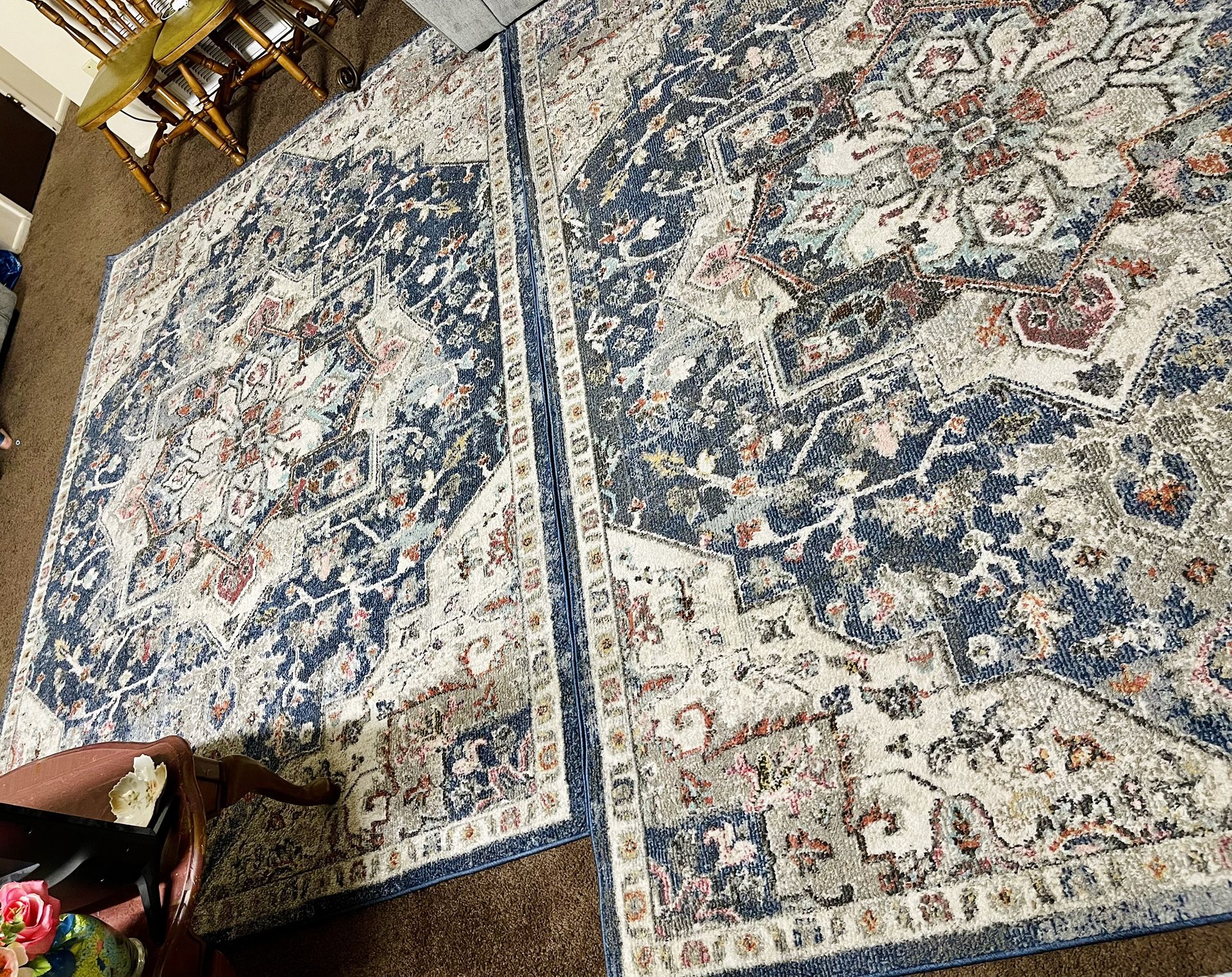 Two distinctive rugs with an antique design