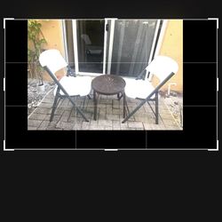 2 chairs a small table