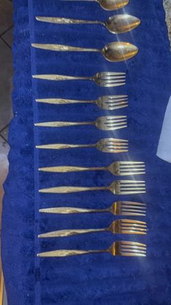 Silverware Gold silver wear with a vintage Oreo lunchbox and antique glass