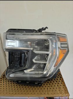 Front left headlight (driver's side) for a GMC Sierra 1500 pickup truck (compatible with model years 2019–2021 and some models up to 2022).