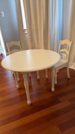 White chairs and table for kids