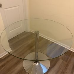 Glass table. 39 1/2in glass 28in height. 