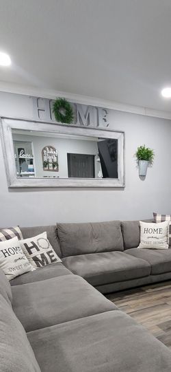 Mirror with Home Decor signs and 2 side decorations.