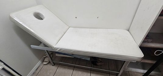Stationary massage table massage bed