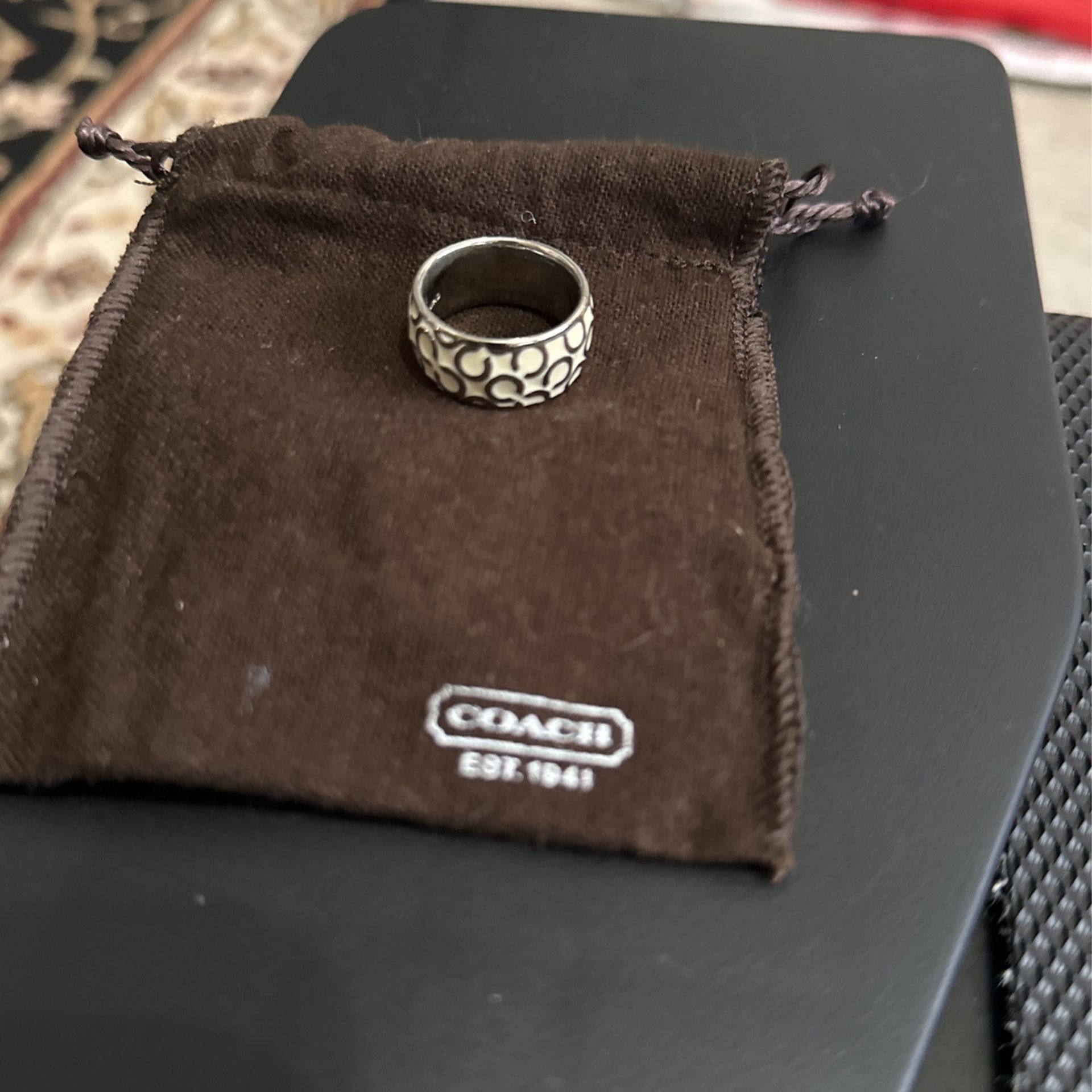 COACH SILVER AND WHITE LOGO BAND RING