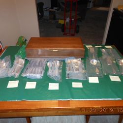 88-Piece Silver-plated Flatware Set, service sets for 16, plus 7 serving pieces, and wooden chest.