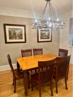 Beautiful solid wood dining room table and 8 chairs