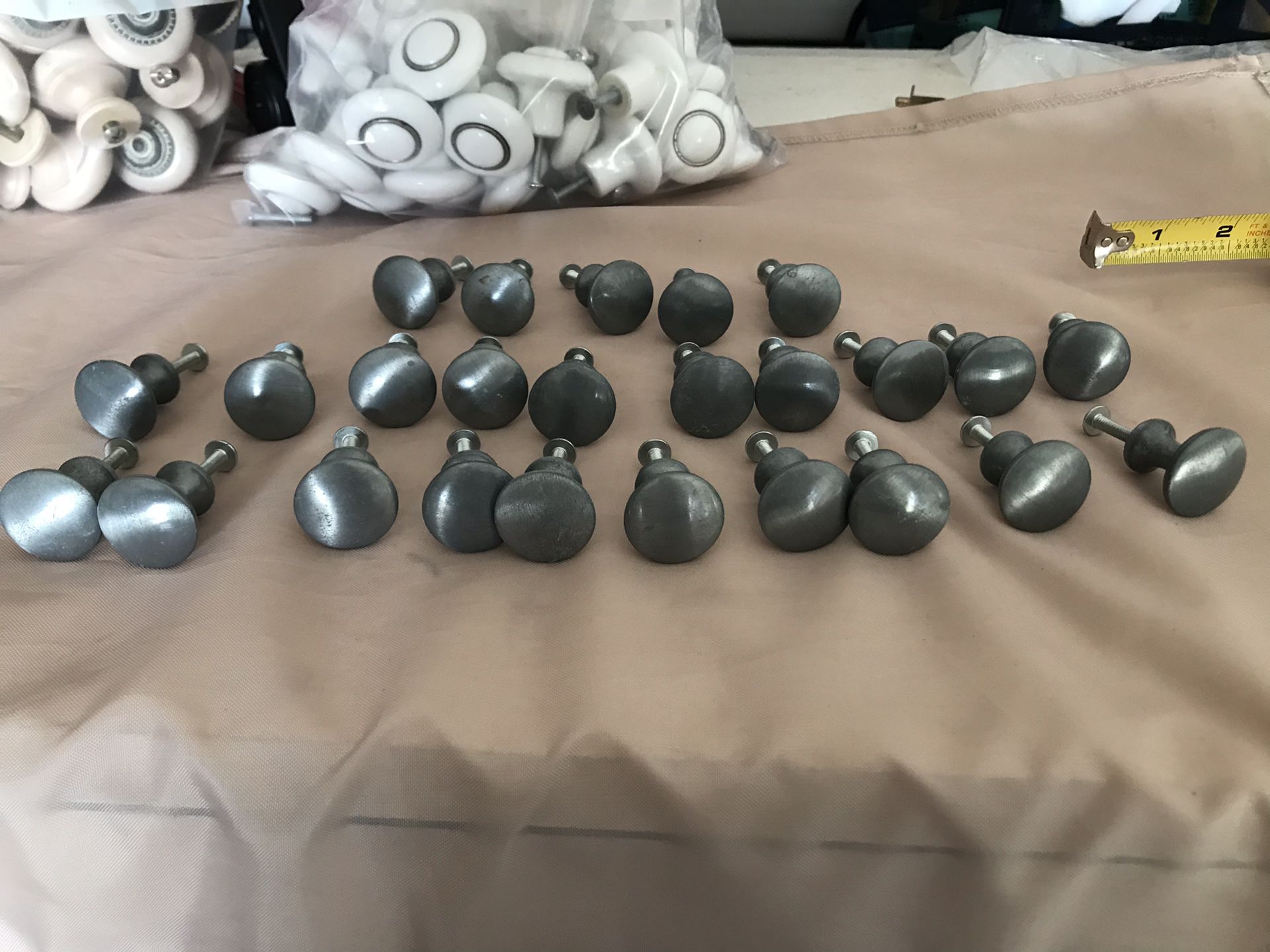 25 pewter color dresser knobs. In great condition