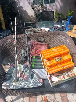 2 fishing poles, fishing backpack and tacklebox