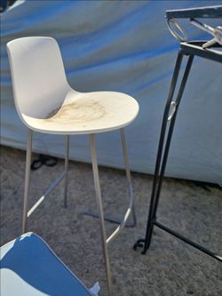 2 white molded-plastic shell bar stools. $125/each.