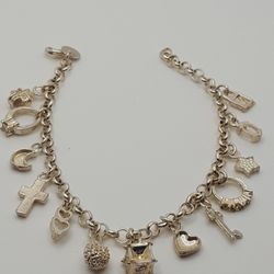 Vintage Charm 925 Silver, 16.74grs, 8.5"inches length, This bracelet includes 13 charms
