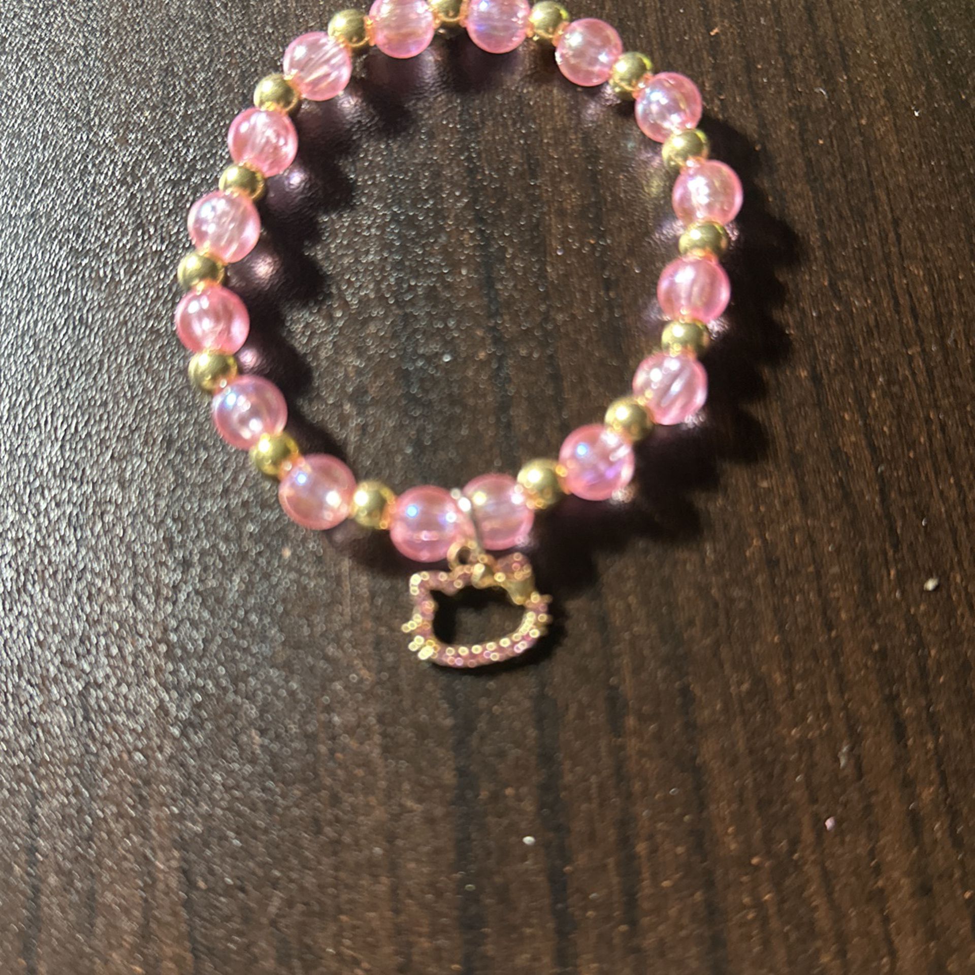 Pink And Gold Beads With A Hello Kitty Gold
