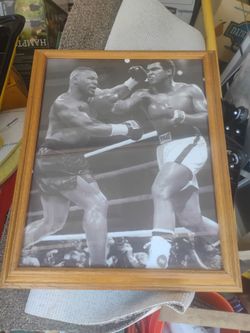 Black and white photo of Muhammad Ali and Mike Tyson boxing