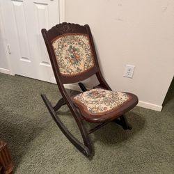 antique wooden folding rocking chair dark finish and colorful floral tapestry upholstery good condit  PICK UP IN DEER PARK 77536