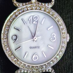 ladies women's mother of pearl face watch with rhinestones pink watch band and a new battery $5