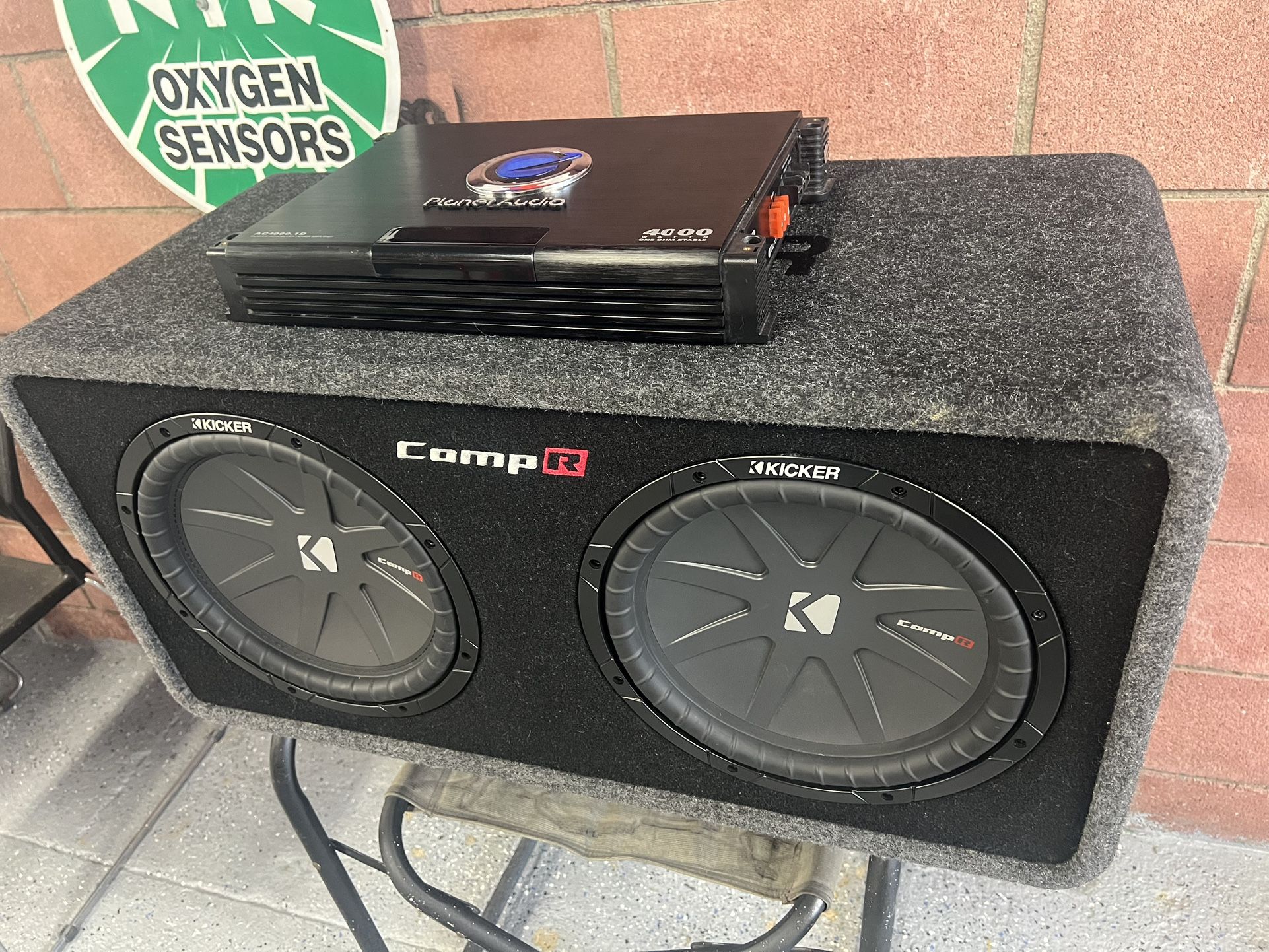 40DCWR122 Ported enclosure with dual 12” Comp R Subwoofer 1 Planet Audio Amp 4000/1 Ohm Stable in excellent condition