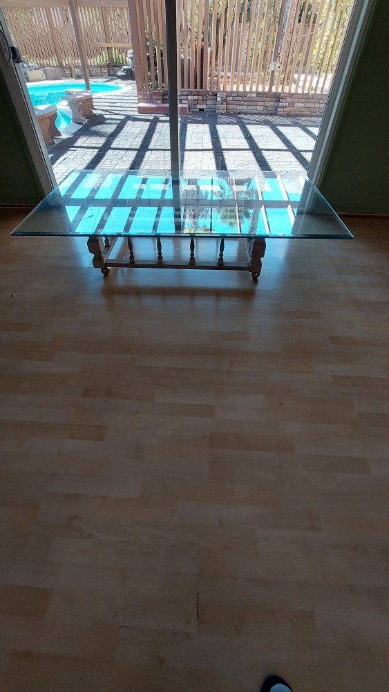 Glass Top Coffee Table With Hand Built Base On Rollers