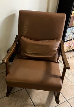 Brown faux leather rocking chair