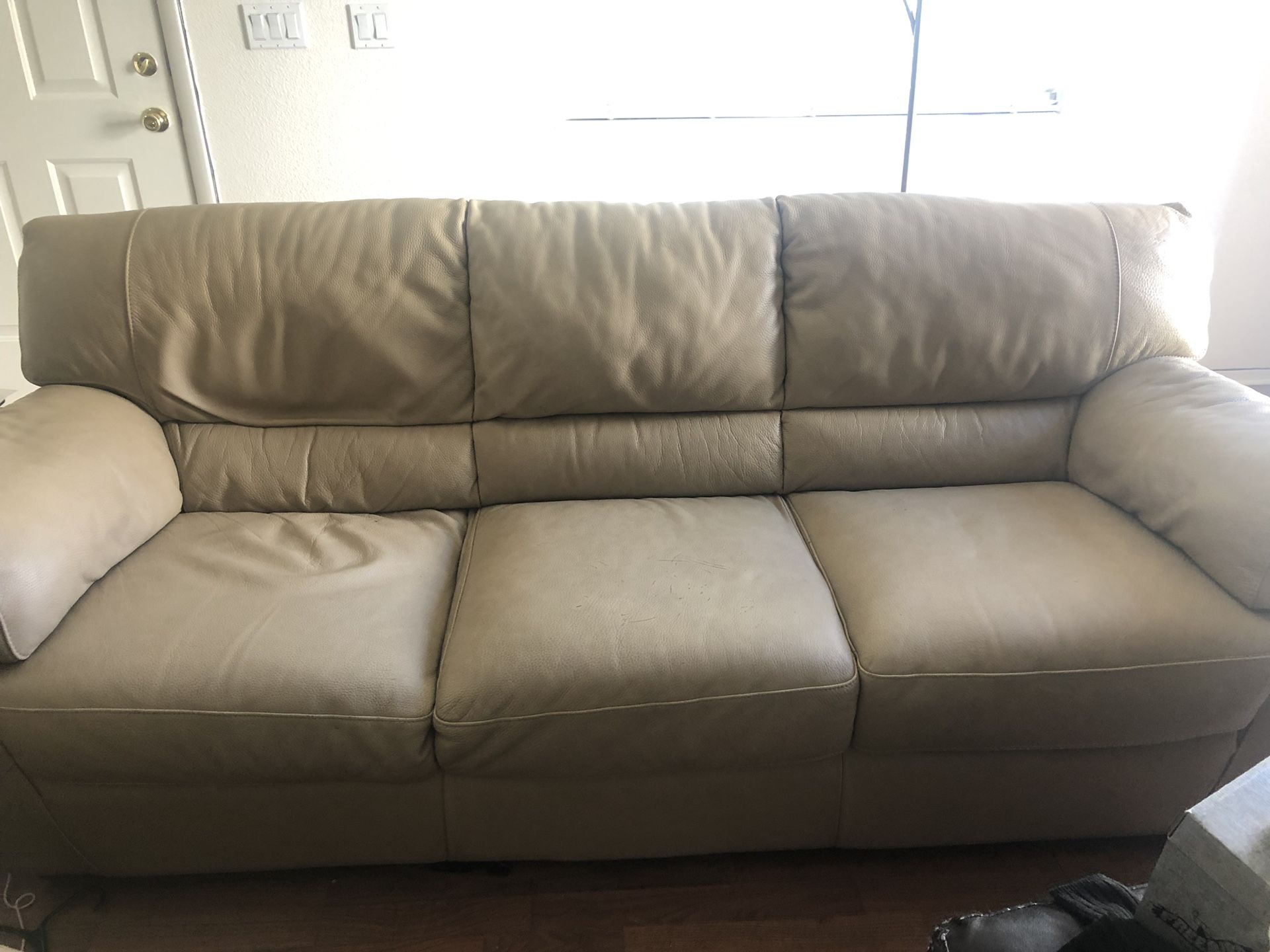 Beautiful Natuzzi Leather Couch, chair and matching ottoman
