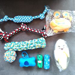 NEW: 9 Piece Set of Dog Toys, Poop Bags and Dispenser with Clip