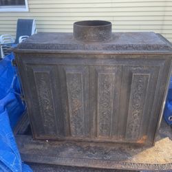 An Antique Small Cast-Iron Fireplace  Wood-Burning Stove