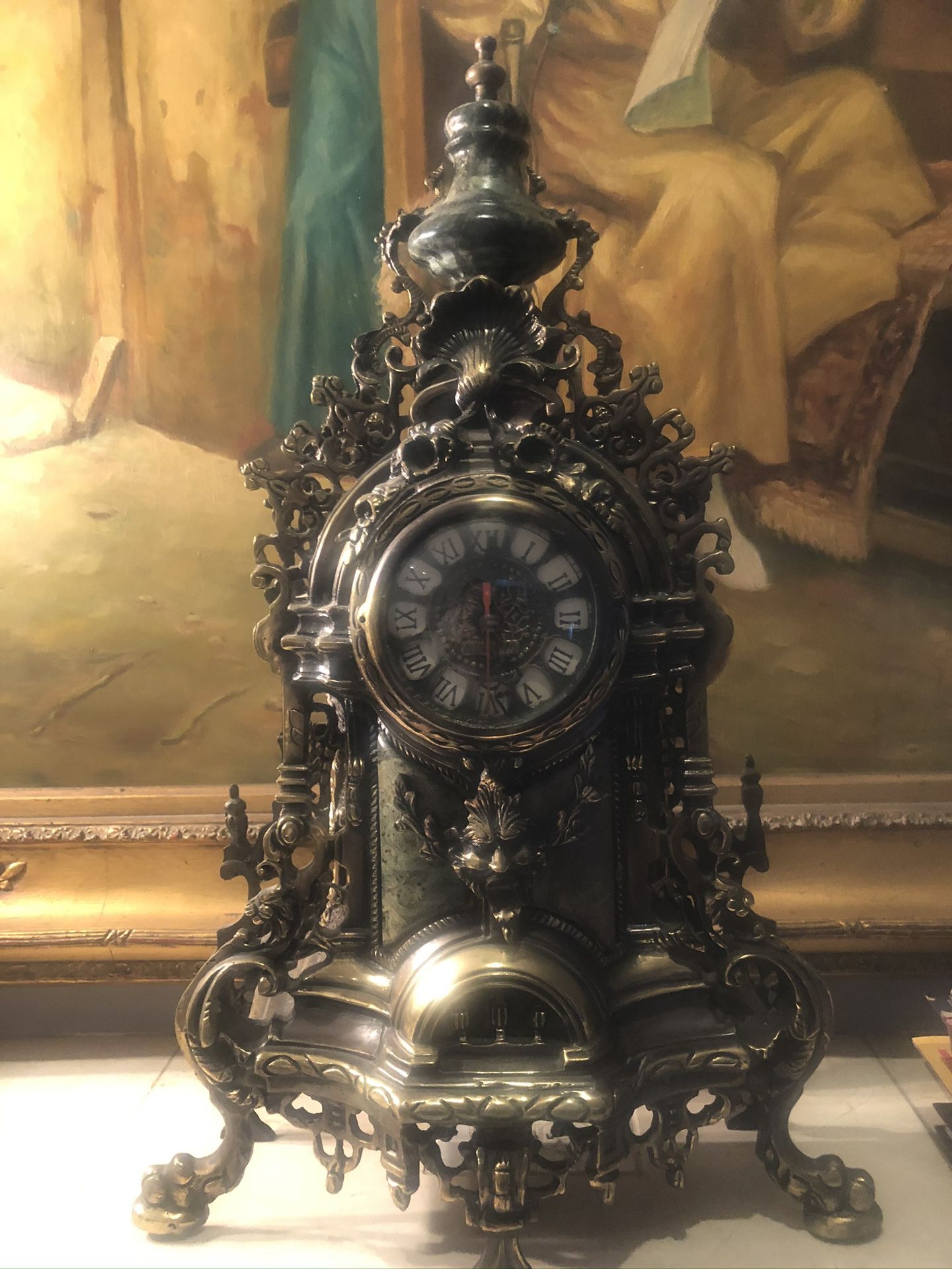 To candelabras with the clock marble