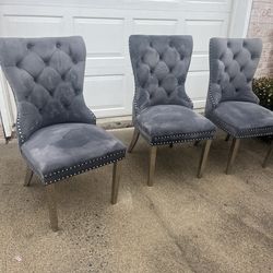 Three velvet chairs