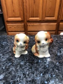 Vintage ceramic Pair of Salt and Pepper Shaker with stoppers.  Very cute dogs.  Size 3 inches tall.  Preowned Excellent condition.  Has been on displa