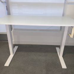 Manually adjustable height white desk with a hand crank(l 47.25”x w 23.625” x h 29.5” to 45.25”)