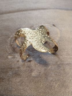 This textured gold-tone metal nautical cuff bracelet
