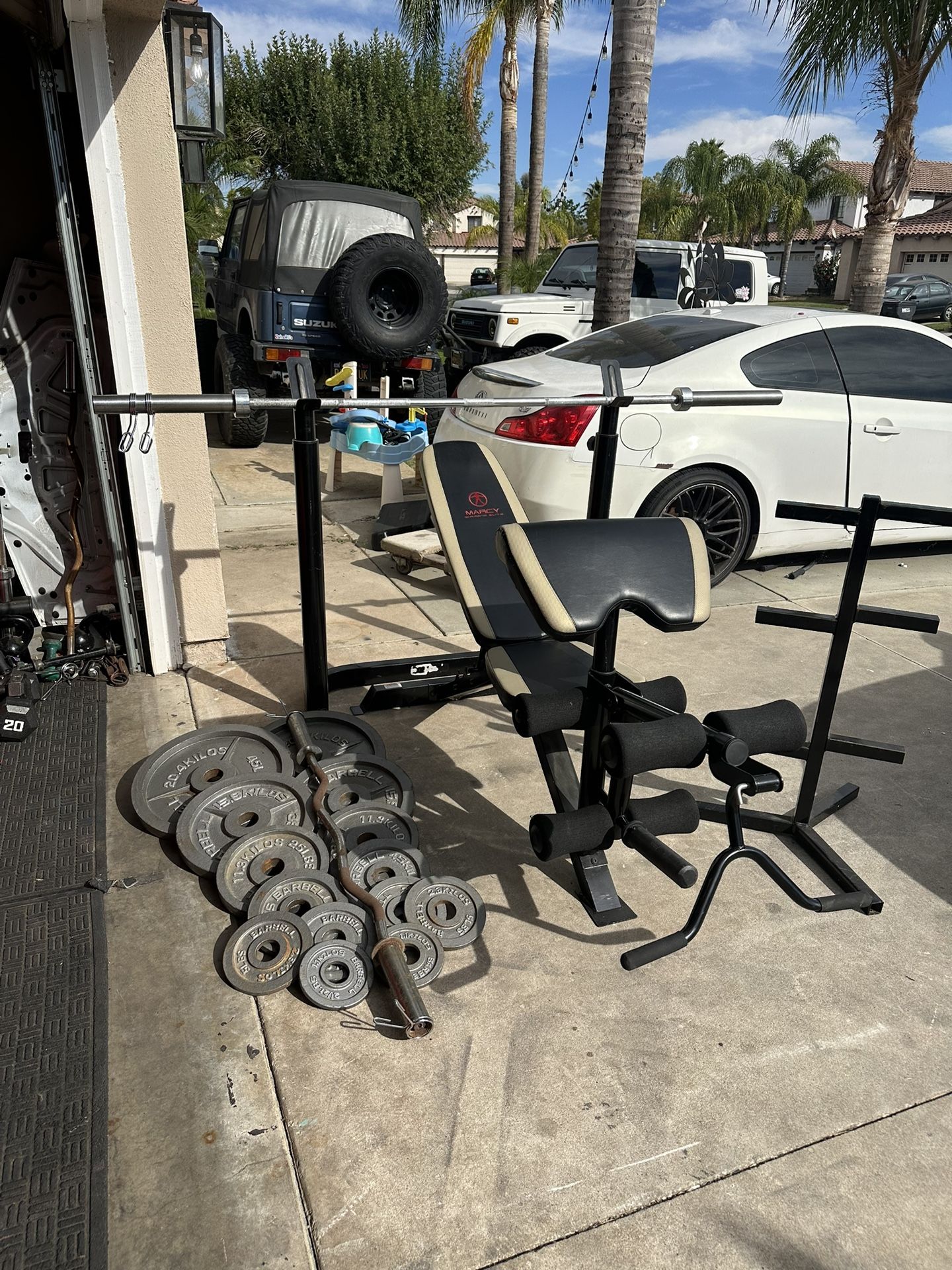 Bench press/squat rack with 7ft 45lbs bar and 255lbs of Olympic weights and curl bar Plus Weights Tree