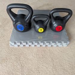 Brand New Set Of Kettlebells As Well As A Pack Of Mats