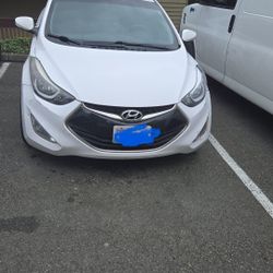 Hyundai Elantra 2D, white color, title in hand.
