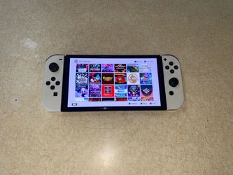 NINTENDO SWITCH OLED MOD + 125 SWITCH GAMES and 7500 CLASSIC GAMES