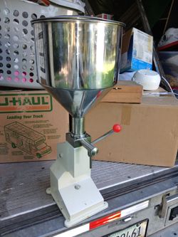 ** LIQUID PASTE FILLING MACHINE