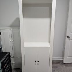 Barely used, White tall adjustable cabinet/shelf.