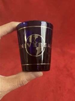 UNIVERSAL STUDIOS LOGO HOLLYWOOD DARK BLUE SILVER PRINT SHOT GLASS ~ RETIRED