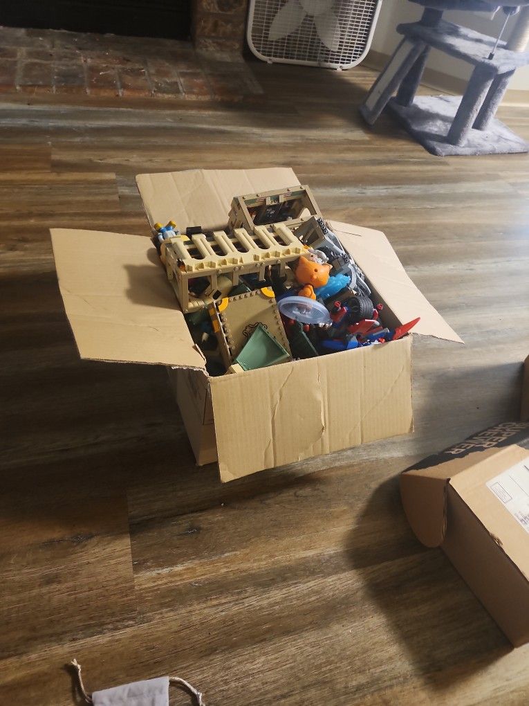 An assortment of Lego sets and other small toys