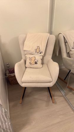 Rocking chair with blanket and pillow