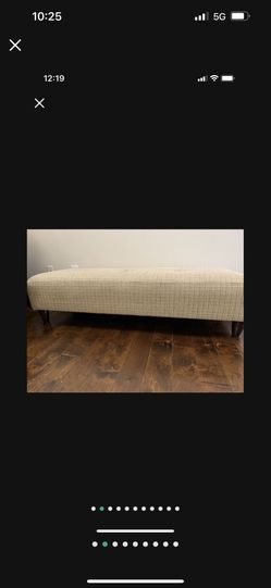 Long Couch With One Blanket And All Pillows