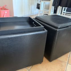 Two 16”x16”x16” Black Storage Ottomans With Reversible Tops