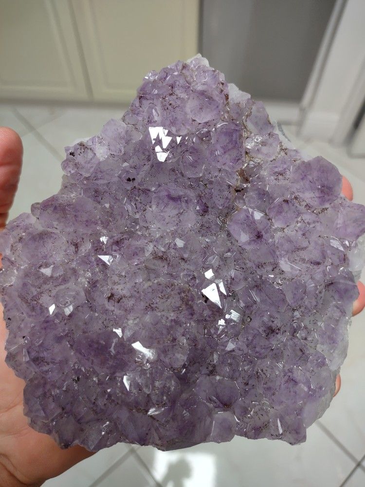 Amethyst Crystal Cluster Display Specimen. Smooth, Polished sides with the back and front left natural;5" H x 4.5" W x 2" D; Weight 2.326 Lb.