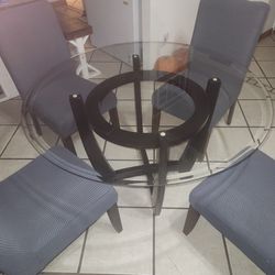 Dining Room Table With Chairs (Chairs Are White Under The Grey Cover)