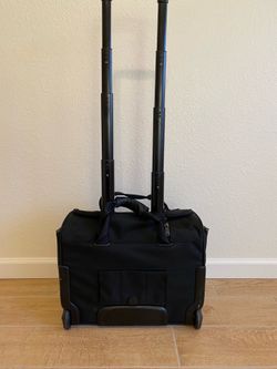 Tumi compact carry on luggage