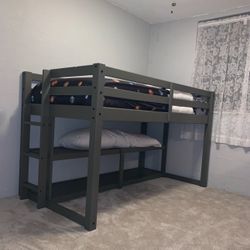 Single Twin Size Bunkbed with sitting area and storage shelve Underneath.