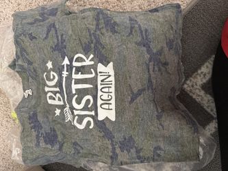 Size 4 “big sister again” announcement , Camo color shirt